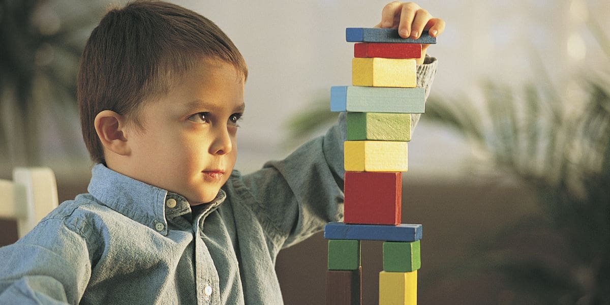Child hyperfocused on playing with blocks